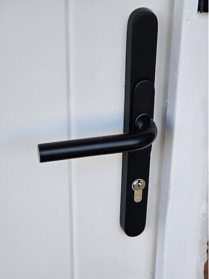 Replacement black handles to complement this white door
